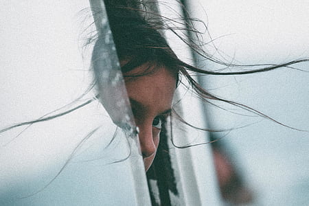 girl peeping in vehicle at daytime thumbnail