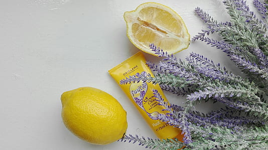 yellow lemon beside lavender flower on white surface thumbnail