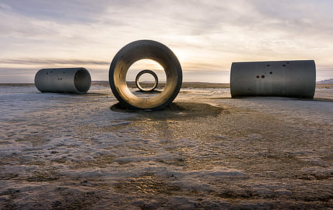 four well rings on beach sand thumbnail