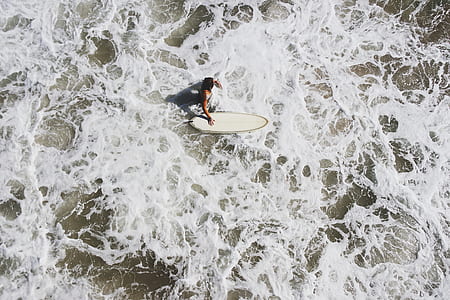 man riding surf board thumbnail