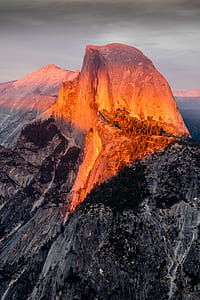brown and gray mountains under gray clouds thumbnail