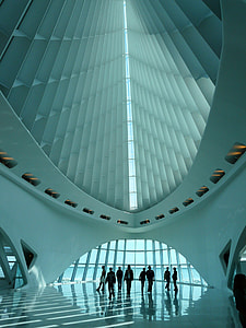 people inside white high rise building during daytime thumbnail