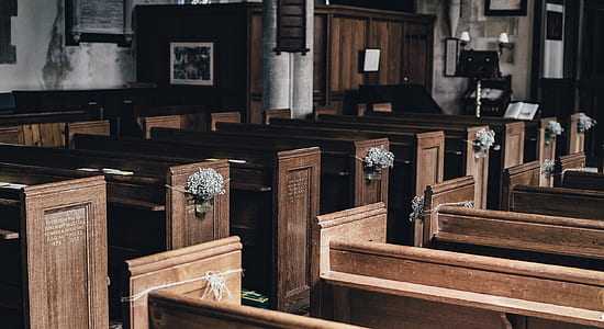 photo of brown wooden pews in church thumbnail