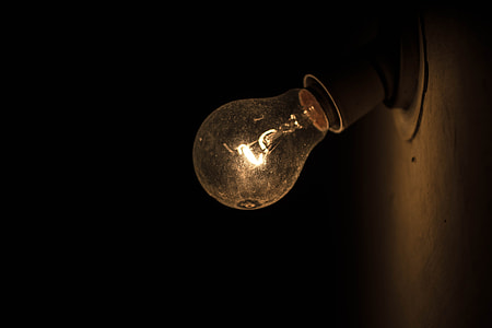 clear glass light bulb turned on \ thumbnail