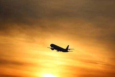 silhouette of airplane during sunset thumbnail