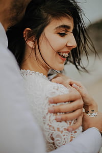 woman smiling while taking photo during daytime thumbnail