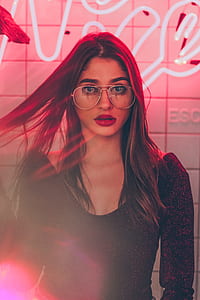 woman wearing black long-sleeved top and eyeglasses thumbnail