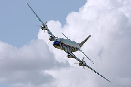 Chrome Airplane Flying during Daytime thumbnail