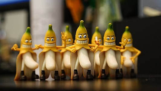 selective focus photography of banana figurines thumbnail