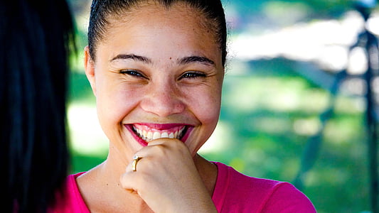 smiling woman with pink shirt at daytime thumbnail