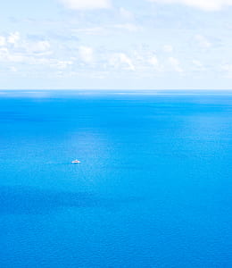 high-angle photography of boat on sea thumbnail