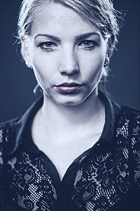 selective color of woman wearing black floral collared shirt thumbnail