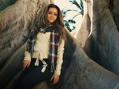 woman standing near tree during daytime thumbnail