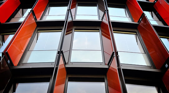 concrete structure with black metal frame clear glass panel windows thumbnail