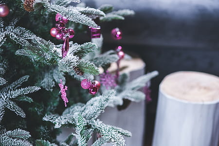 green Christmas tree with purple garland thumbnail