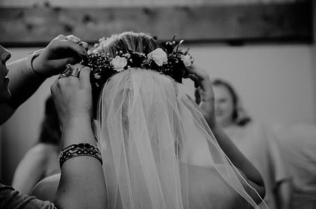 grayscale photograph of woman wearing wedding veil thumbnail