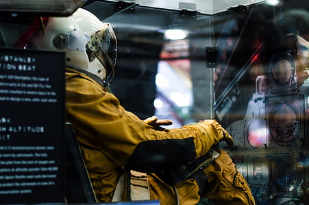 person wearing yellow suit with helmet thumbnail