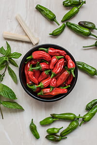 red and green chili peppers on bowl thumbnail
