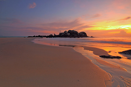 Sunset over the sandy beach thumbnail