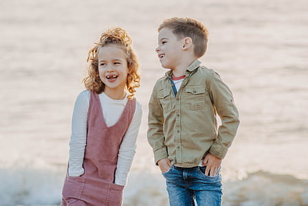 two boy and girl standing on field thumbnail