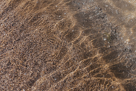 Soft wave of the sea on the sandy beach thumbnail