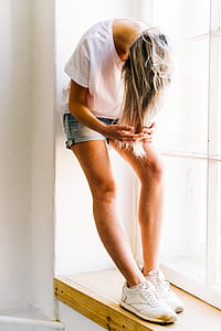 Woman in White T-shirt and Blue Denim Shot Shorts thumbnail