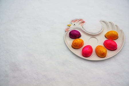 assorted-color eggs on chicken-shaped tray thumbnail