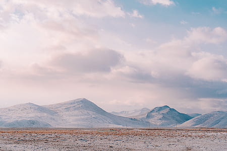 snow frosted mountain during daytime thumbnail
