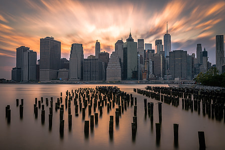 time lapsed photography of city building beside sea water thumbnail