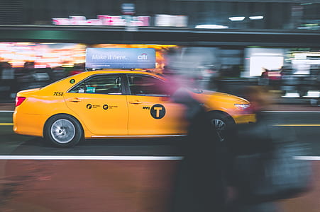 yellow taxi on street road thumbnail