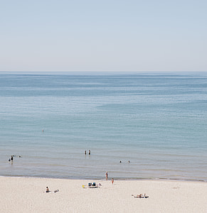 people near body of water during daytime thumbnail