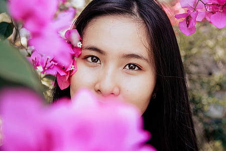 woman beside pink bougainvillea flowers thumbnail