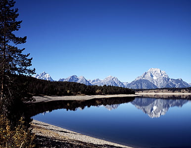 body of water near mountain alps graphic wallpaper thumbnail