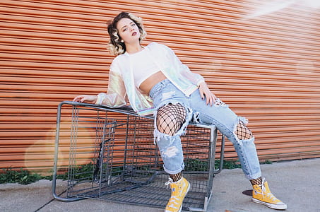 woman sitting on shopping cart thumbnail