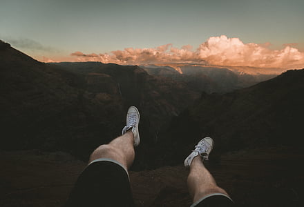 man sitting on top of mountain thumbnail