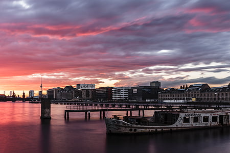 black boardwalk under pink sky during daytime thumbnail
