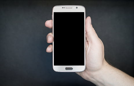 person holding white Android smartphone thumbnail