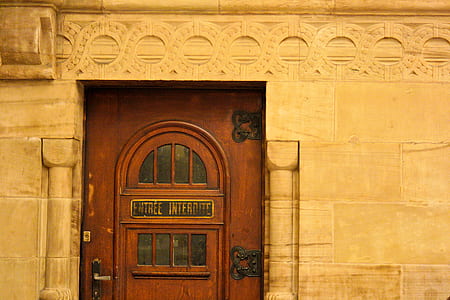 brown wooden door beside wall thumbnail