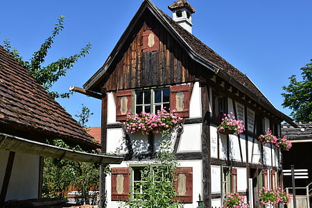 white and brown wooden 3-storey house at daytime thumbnail