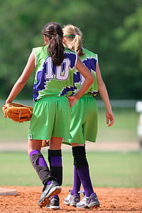 woman wearing brown leather baseball mitt thumbnail