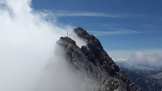 photo of a mountain with clouds thumbnail