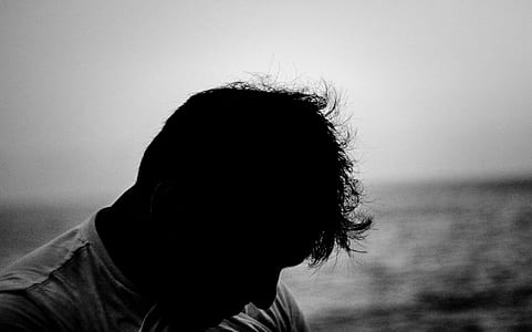 silhouette of man in front of ocean thumbnail