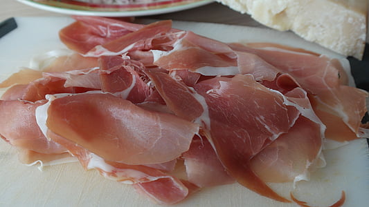 sliced raw meats on white chopping board thumbnail