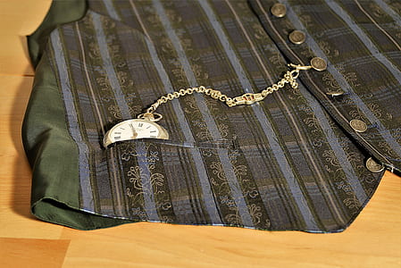 gold-colored pocket watch on vest pocket thumbnail
