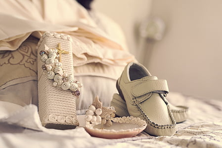 pair of white leather shoes on white floral textile thumbnail
