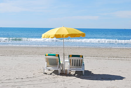 two adirondack chairs on the beach thumbnail