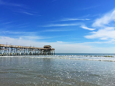 brown dock view under blue sky thumbnail