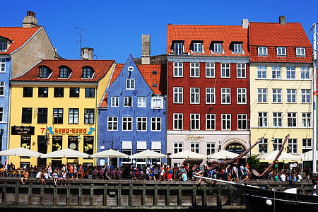 assorted-colored concrete building under blue sky thumbnail