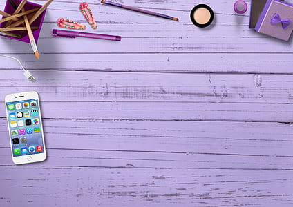 silver iPhone 6 near purple pen thumbnail