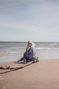 woman sitting on beach thumbnail